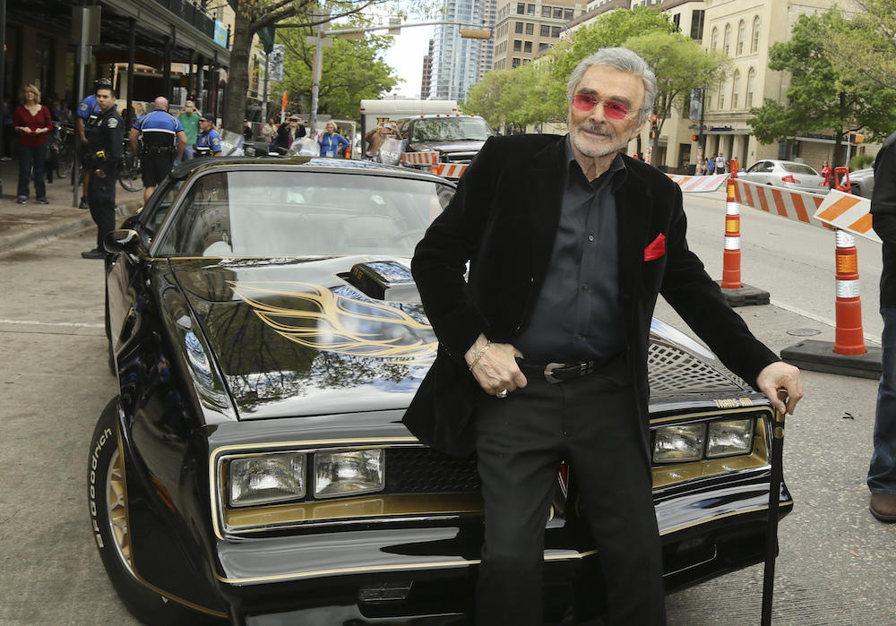 In this March 12, 2016 file photo, Burt Reynolds sits on a 1977 Pontiac Trans-Am at the world premiere of 