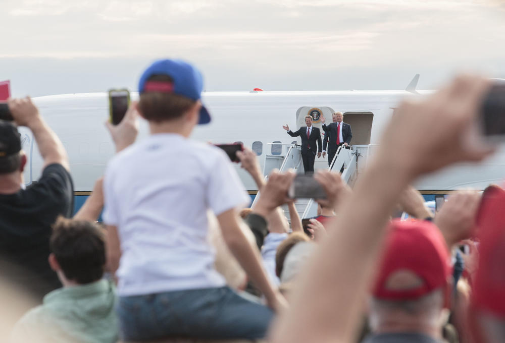 Secretary of State and gubernatorial candidate Brian Kemp, Sen. David Perdue and President Donald Trump leave Air Force One at Middle Georgia Regional Airport in Macon Sunday. 