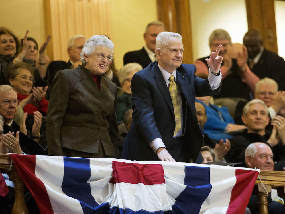 Former Georgia Governor Zell Miller, right, waves when acknowledged with wife Shirley during an inaugural ceremony for Georgia Gov. Nathan Deal at the state Capitol, Monday, Jan. 12, 2015, in Atlanta. 