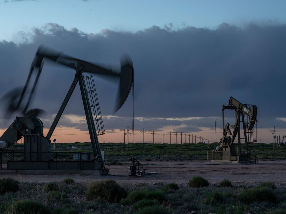 Pump jacks operate at dusk near Loco Hills in Eddy County, New Mexico, on April 23. U.S. oil producers are grappling with prolonged low oil prices and the uncertainty created by the coronavirus pandemic.
