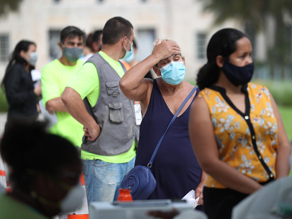 Carmen Garcia stands in line on Friday to be tested for COVID-19 at a Mobile Testing Truck in Miami Beach, Fla. The units were brought to the area as the cases of coronavirus spike in Florida.