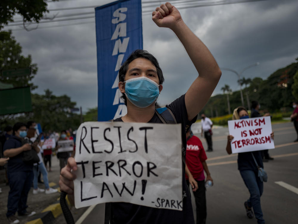 A protester wearing a face mask demonstrates against the Philippines' new anti-terrorism law on July 4, in Quezon city, Metro Manila. Earlier this month, President Rodrigo Duterte approved a law that critics say could lead to more human rights abuses.