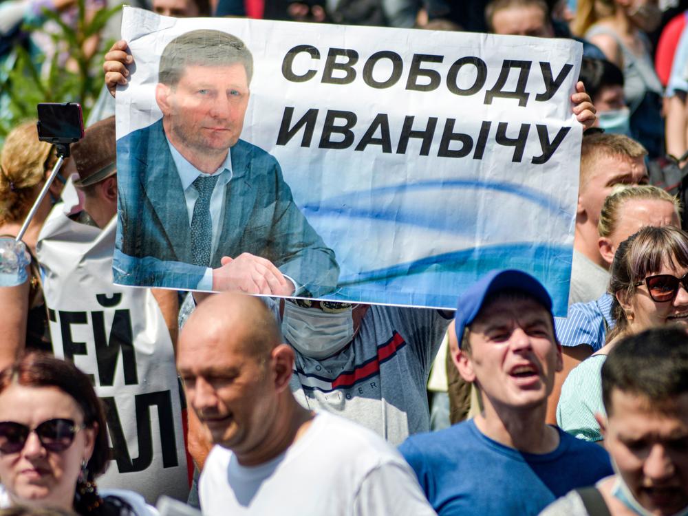 People carry a banner demanding freedom for Furgal during a demonstration in Khabarovsk on July 18.