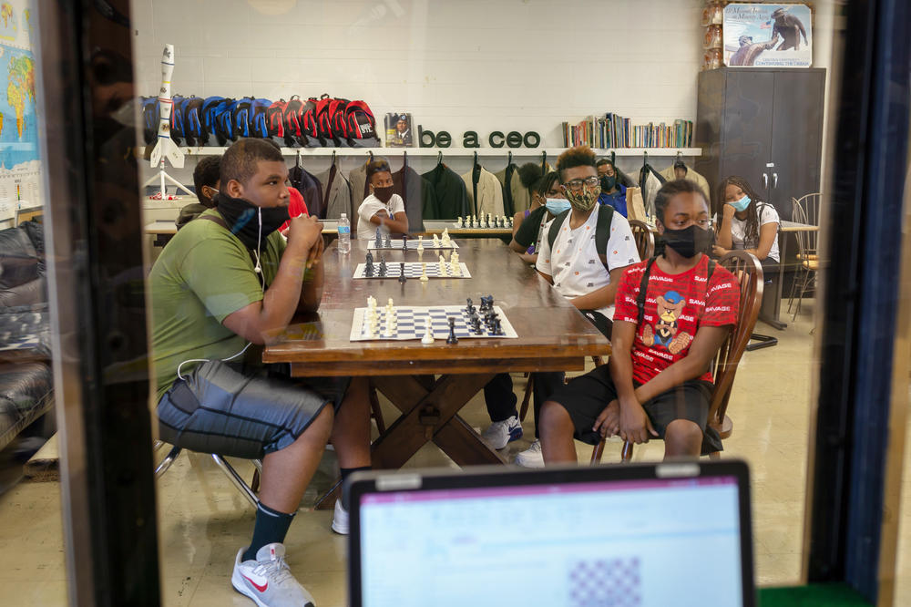 Students in the summer chess program are required to wear masks in class and have the option to wear gloves.