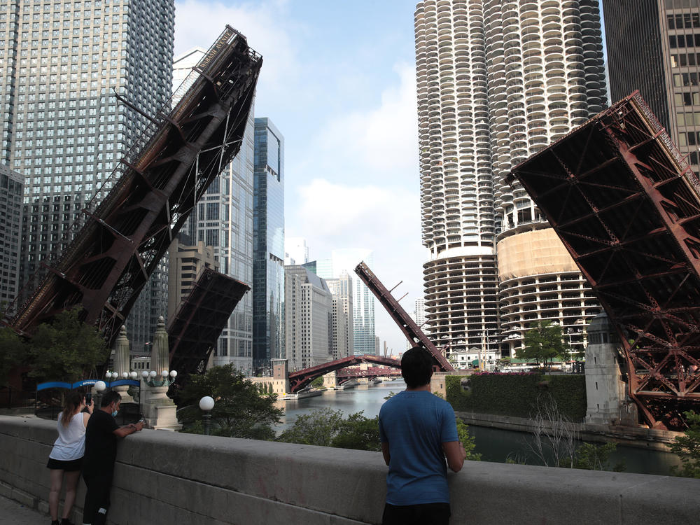 Bridges that lead into downtown Chicago were raised to limit access after looting and vandalism late Sunday and early Monday. Police made more than 100 arrests during the night of unrest and confiscated five guns.