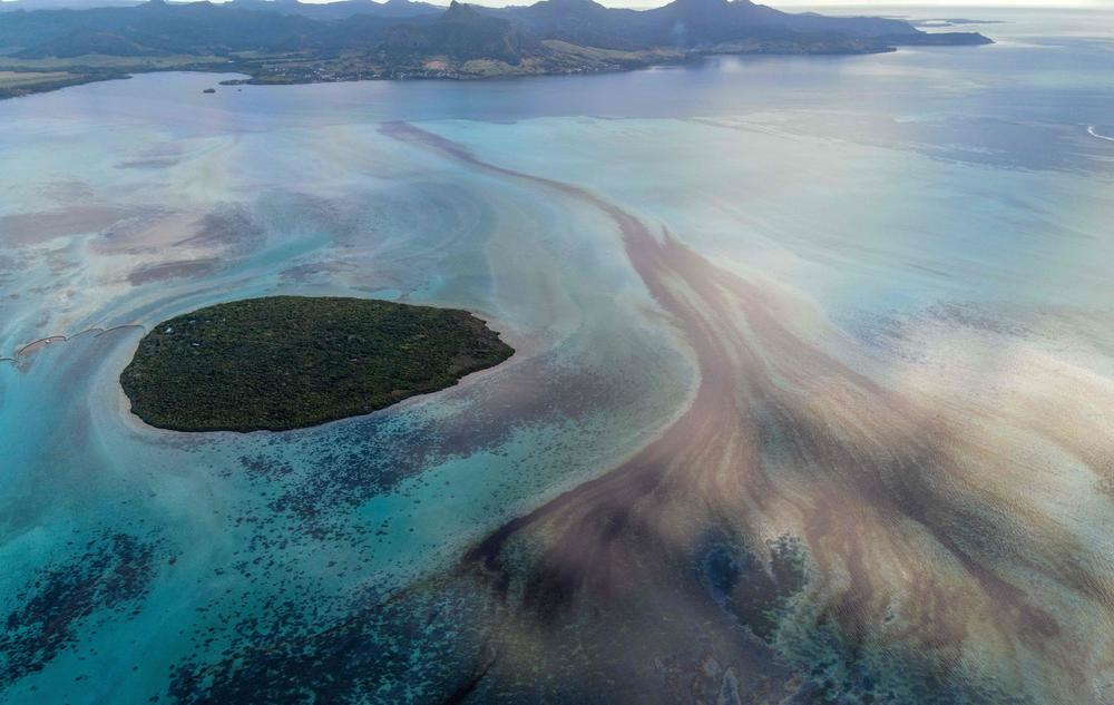 A large patch of leaked oil travels on ocean currents near the Pointe d'Esny in Mauritius on Saturday. The worsening oil spill is polluting the island nation's famous reefs, lagoons and oceans.