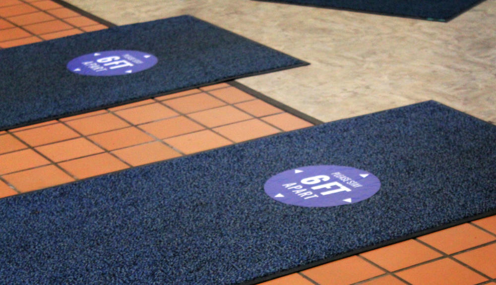Fort Street Elementary uses labeled rugs to help students social distance.