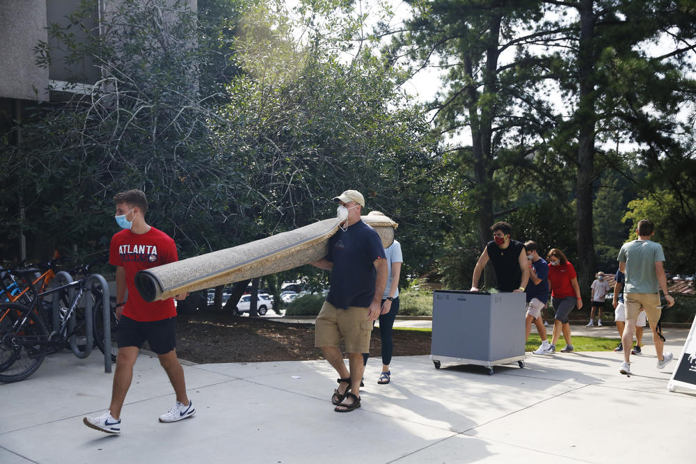 Students move into dorms on Monday at the University of Georgia in Athens.