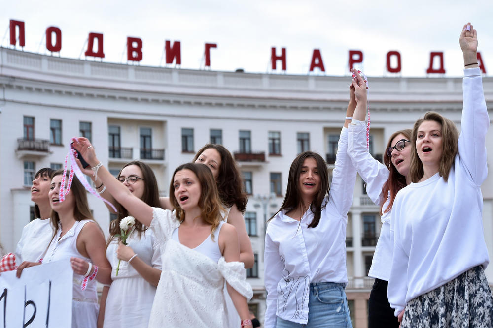 Women dressed in white protest against police violence in Minsk on Aug. 12.