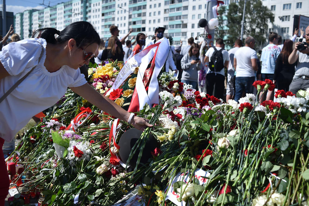 Belarus opposition supporters lay flowers near the Pushkinskaya metro station where Alexander Taraikovsky, a 34-year-old protester, died on Aug. 10, during a protest in Minsk.