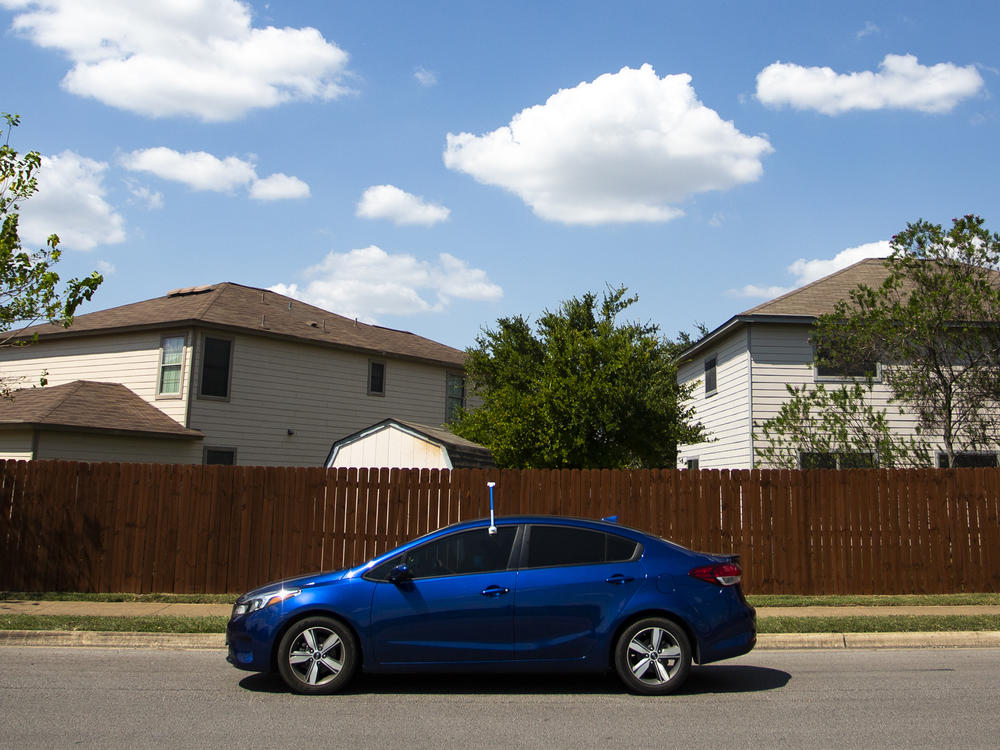 Frances Acuña drives through southeast Austin with a sensor attached to her driver's side door. It's part of a federal study to measure rising urban heat.