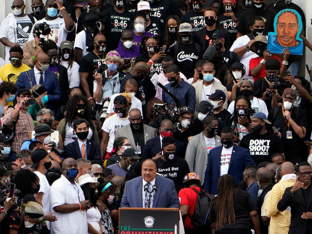 Human Rights Advocate Martin Luther King III, center at bottom, speaks at the Lincoln Memorial during the 