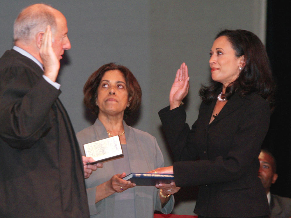 Kamala Harris receives the oath of office from California Supreme Court Chief Justice Ronald M. George during her inauguration on Jan. 8, 2004, as San Francisco's district attorney. In the center is Harris' mother, Shyamala Gopalan.