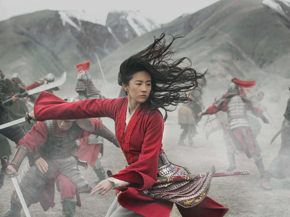 A gifted warrior (Liu Yifei) discovers her true purpose when China comes under attack by nomadic forces in <em>Mulan</em>.