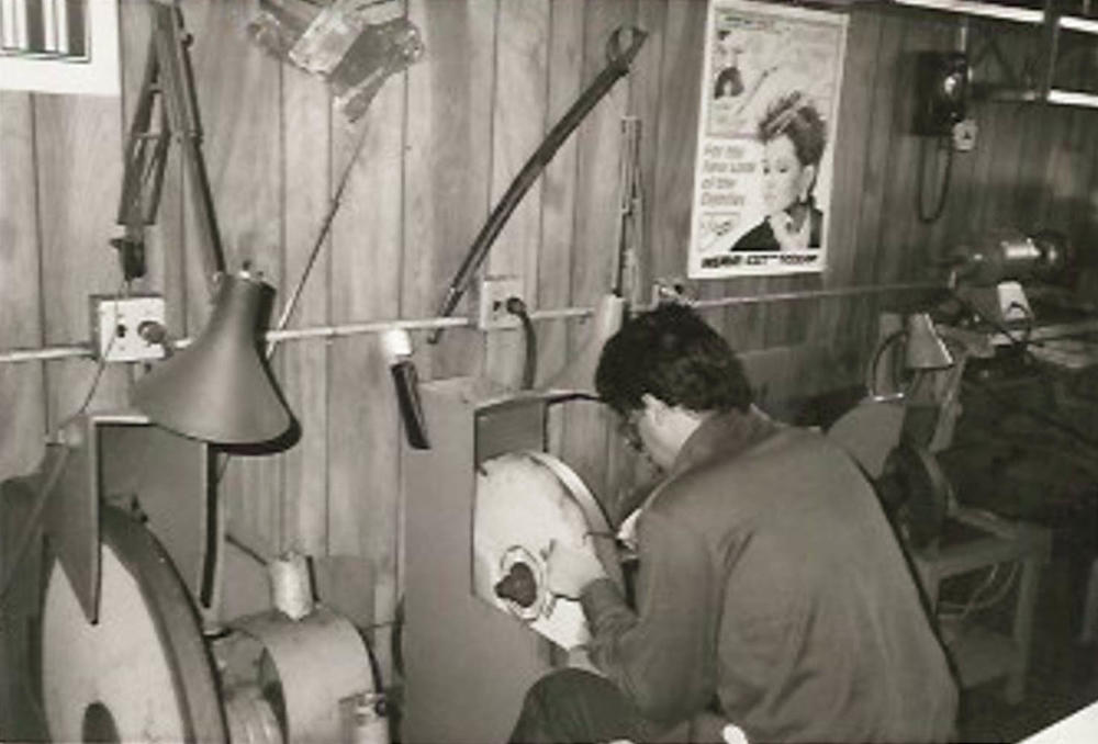 Joe Bianco works at the grinding wheel in the early years of his father's Brooklyn business.