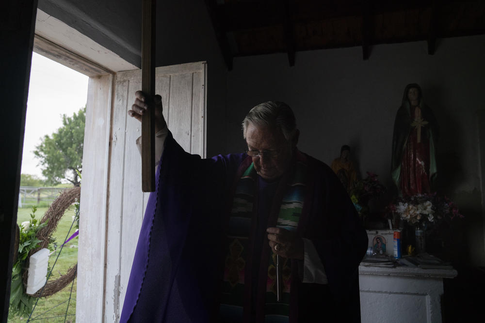 Father Roy Snipes pictured at La Lomita Chapel in Mission, Texas, Friday, June 28 honoring the lives of migrants who died trying to go north. These days he's officiating funerals for COVID-19 victims.