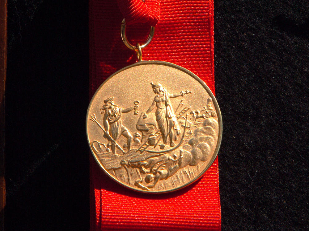 The New York City Fire Department's James Gordon Bennett Medal was established in 1869 and features an image of Neptune (left) wading ashore. It will be renamed the Chief of Department Peter J. Ganci, Jr. Medal.