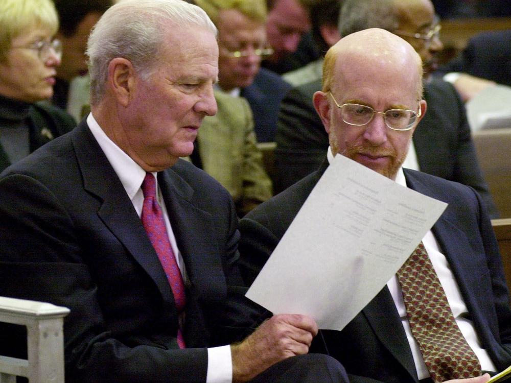 Former Secretary of State James A. Baker (left) confers with attorney Ben Ginsberg before the start of a hearing in the Florida Supreme Court in the days after the 2000 election.