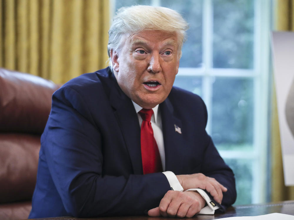 President Trump, pictured in the Oval Office on Thursday, maintains a lead over Democratic presidential nominee Joe Biden on the economy, but is behind on handling of the coronavirus pandemic in a new NPR/<em>PBS NewsHour/</em>Marist poll.