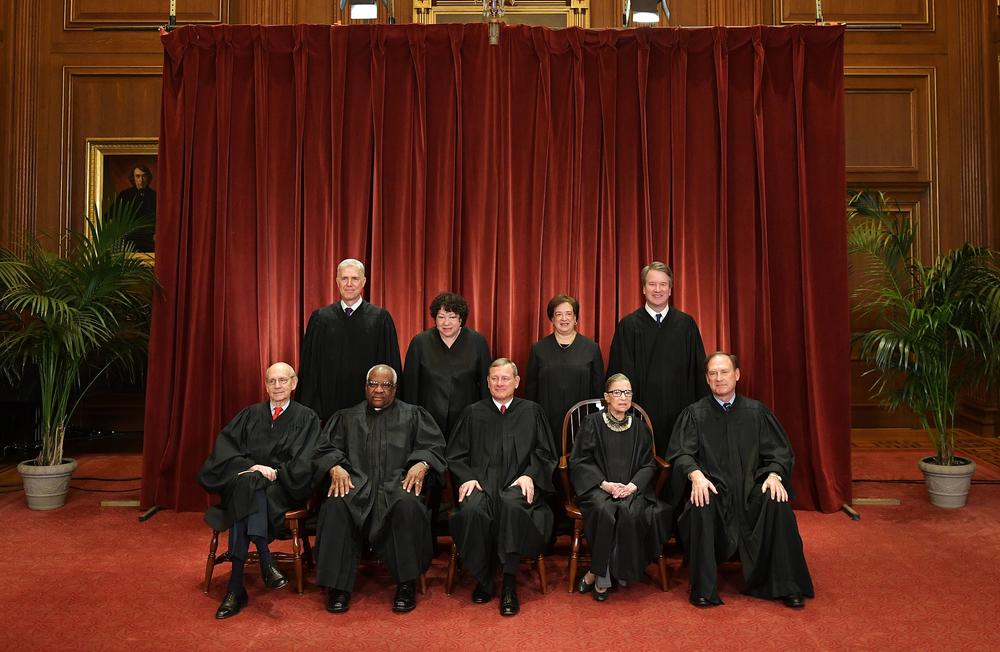 Justices of the U.S. Supreme Court pose for their official photo at the Supreme Court in November 2018. Seated from left: Stephen Breyer, Clarence Thomas, Chief Justice John Roberts, Ruth Bader Ginsburg and Samuel Alito. Standing from left: Neil Gorsuch, Sonia Sotomayor, Elena Kagan and Brett Kavanaugh.