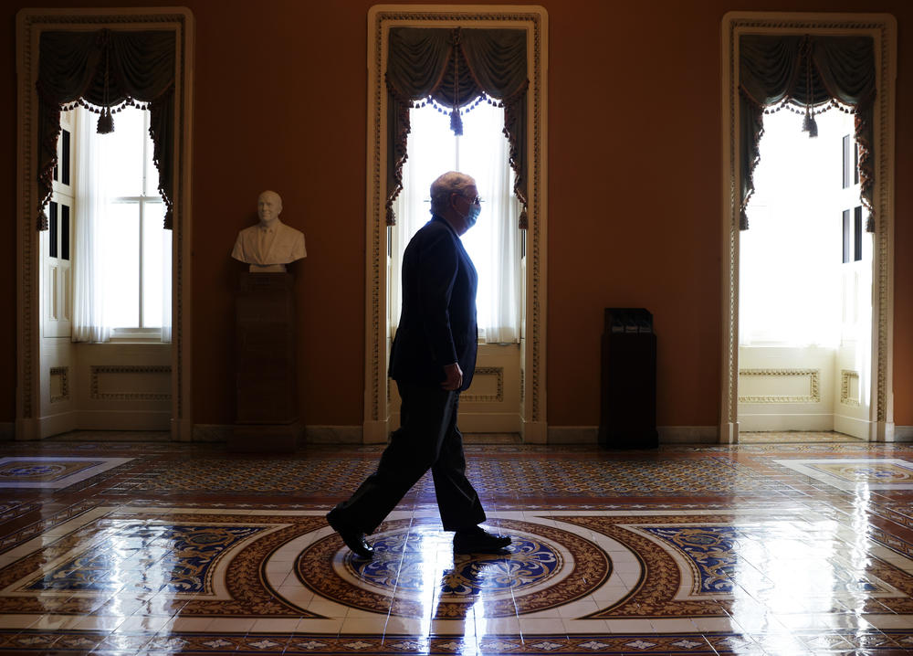 Senate Majority Leader Mitch McConnell, R-Ky., walks in a hallway at the Capitol on Monday. In a statement Ginsburg's passing, McConnell said President Trump's nominee for the bench will receive a vote in the Senate.