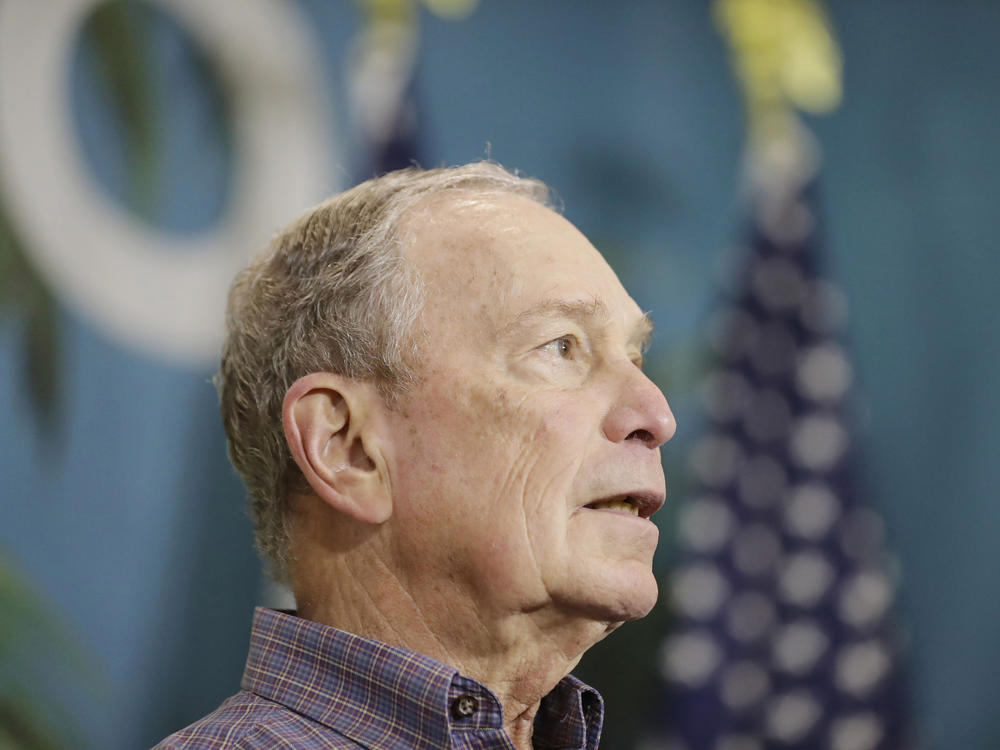 Mike Bloomberg, then a Democratic presidential candidate, speaks at a news conference in March in Miami's Little Havana neighborhood. Bloomberg has helped raise money to pay off felons' fines so they can vote in Florida.