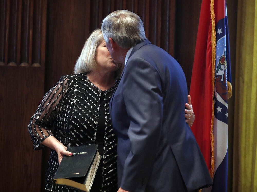 Gov. Mike Parson and his wife, Teresa, share a kiss after he was sworn in as Missouri's 57th governor in 2018.