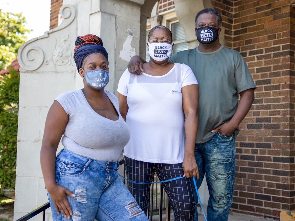 Heavenly Pettigrew, left, and her parents Stephanie and Robert outside their two-bedroom rental apartment in Milwaukee. Without assistance from the nonprofit Community Advocates, the family likely would have faced eviction after the pandemic forced Robert and Heavenly out of their steady jobs.