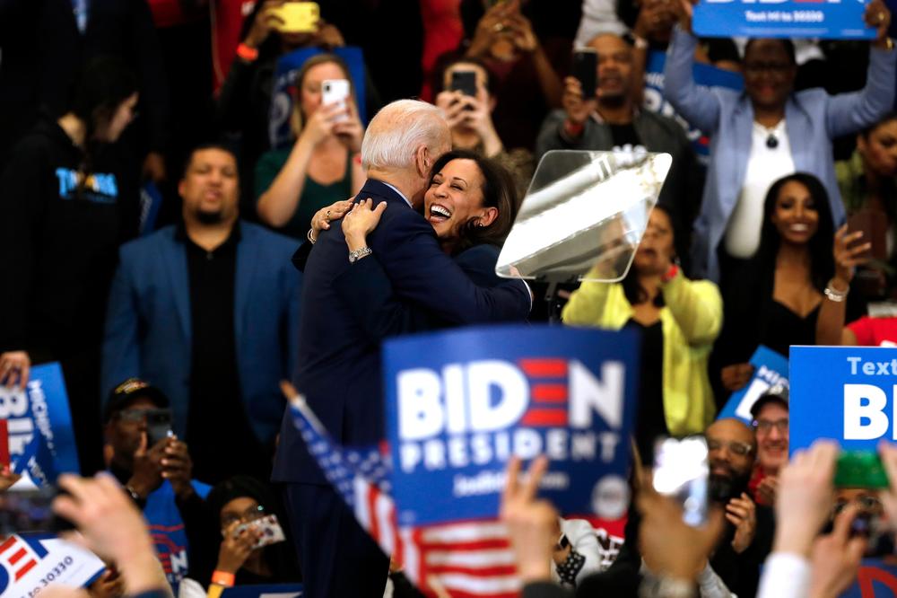 Sen. Kamala Harris hugs Democratic presidential candidate Joe Biden after she endorsed him at a campaign rally in Detroit on March 9, 2020.