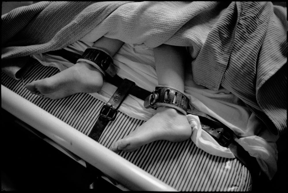 Feet in restraints, Ward 81, Oregon State Hospital. Salem, Oregon, 1976.