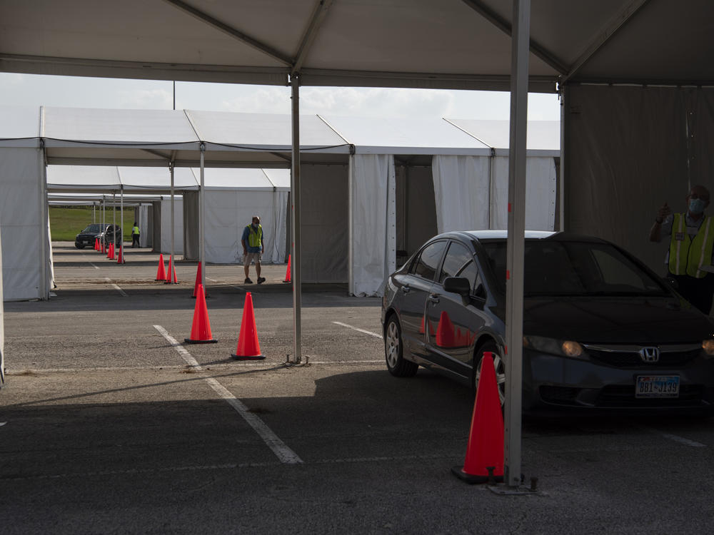 Voters drop off ballots last month at a drive-through polling place in Houston. Some 127,000 voters cast their ballots at drive-through locations in the Houston area.