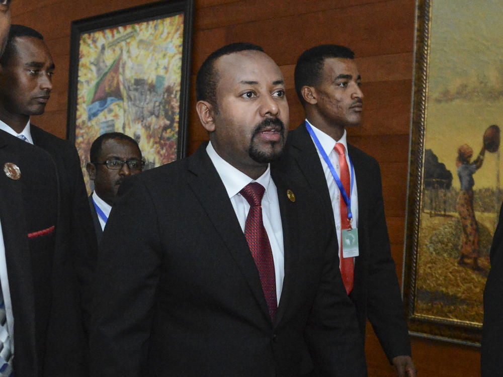 Ethiopia's Prime Minister Abiy Ahmed, center, arrives for the opening session of the 33rd African Union Summit in Addis Ababa, Ethiopia, in February. On Wednesday, Abiy ordered the military to confront the Tigray regional government after he said it attacked a military base overnight, citing months of 