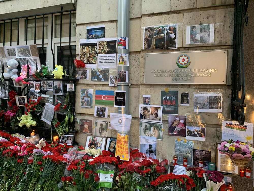 Flowers, stuffed animals and photographs of victims of the renewed fighting over Nagorno-Karabakh have piled up outside the Azerbaijani Embassy in Moscow.