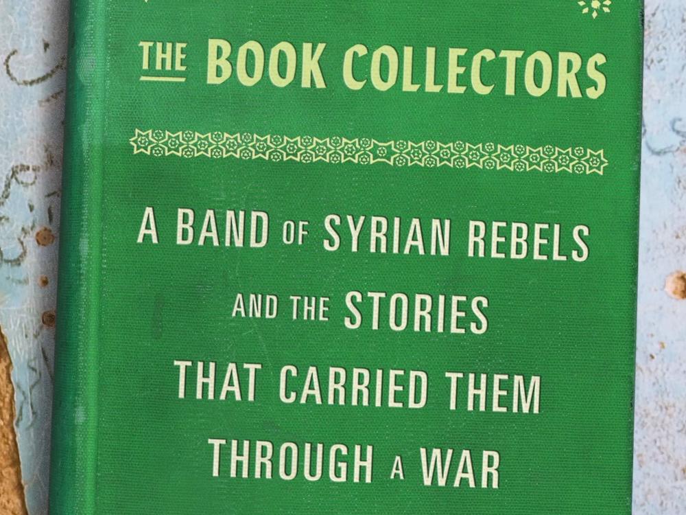 <em>The Book Collectors: A Band of Syrian Rebels and the Stories That Carried Them Through a War,</em> by Delphine Minoui