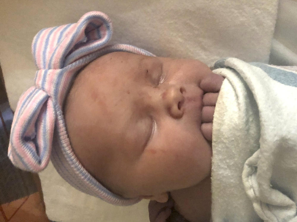 A Michigan couple whose large family attracted attention by growing to include 14 sons welcomed their first daughter nearly three decades after the birth of their first child. Maggie Schwandt was born Thursday, Nov. 5 at a hospital in Grand Rapids, Mich.