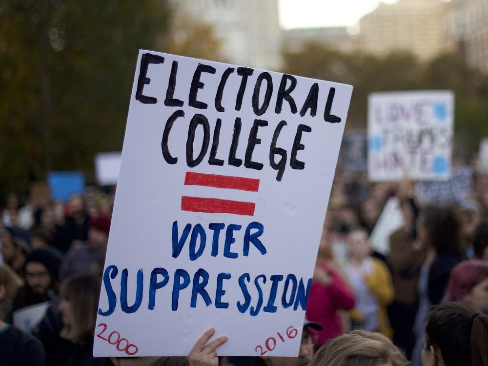 Protesters demonstrate four years ago against Donald Trump, then the president-elect, outside Independence Hall in Philadelphia. Trump won the Electoral College but lost the popular vote by nearly 3 million votes.