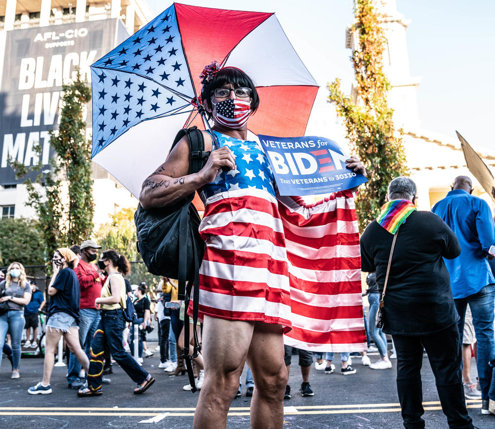 <strong>WASHINGTON, D.C.:</strong> Matt wears a flag outfit on Black Lives Matter Plaza after hearing that Joe Biden and Kamala Harris has won the election.
