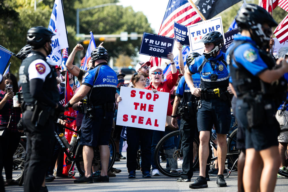 <strong>AUSTIN, TEXAS:</strong> Simultaneous demonstrations in support of President-elect Joe Biden and current President Trump face off in front of the Texas State Capitol in downtown Austin following the announcement of the final presidential election results.