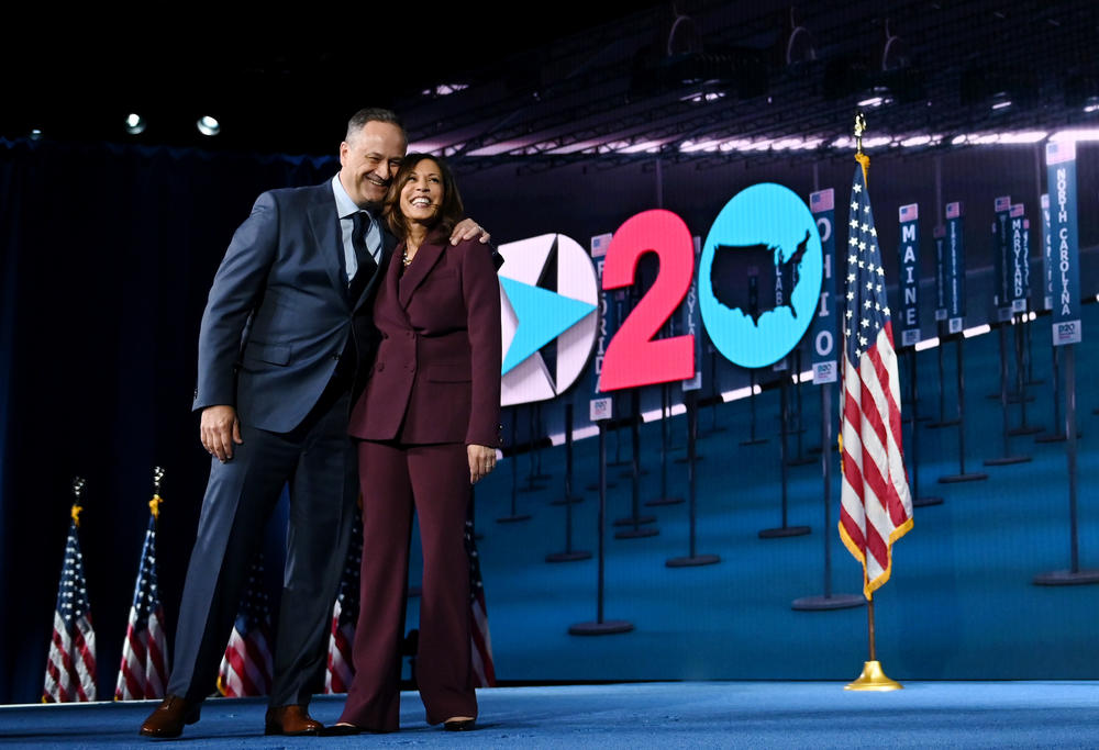 Vice President-elect Kamala Harris and her husband, Doug Emhoff, stand onstage during the Democratic National Convention on Aug. 19.
