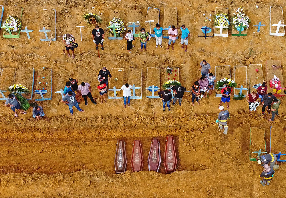 Aerial picture of a burial at the Nossa Senhora Aparecida cemetery in Manaus, in the Amazon forest in Brazil. COVID-19 cases have surged in the area.