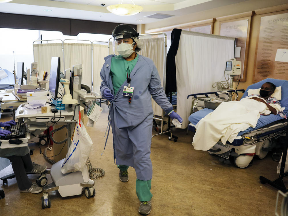 Clinicians work Wednesday in the former lobby of St. Mary Medical Center in Apple Valley, which has been converted into a care space to treat suspected COVID-19 patients.