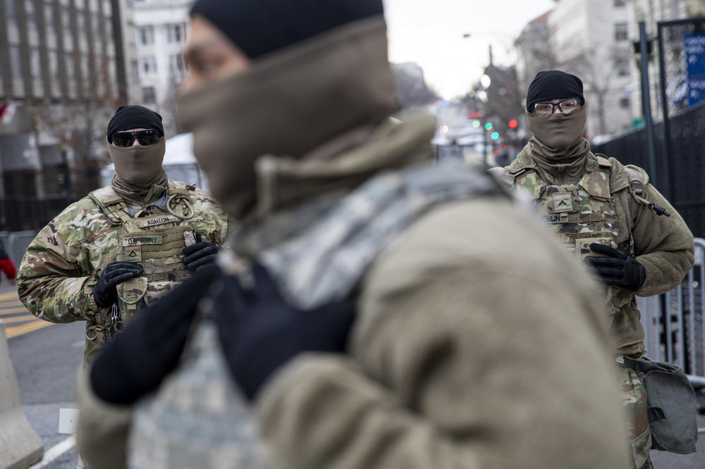 Members of the National Guard stand at a downtown checkpoint in Washington, D.C.