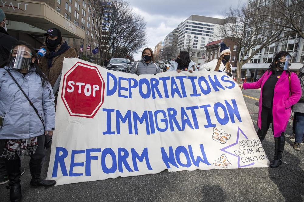Pro-immigration reform activists hold a banner during the inauguration ceremony in Washington, D.C.