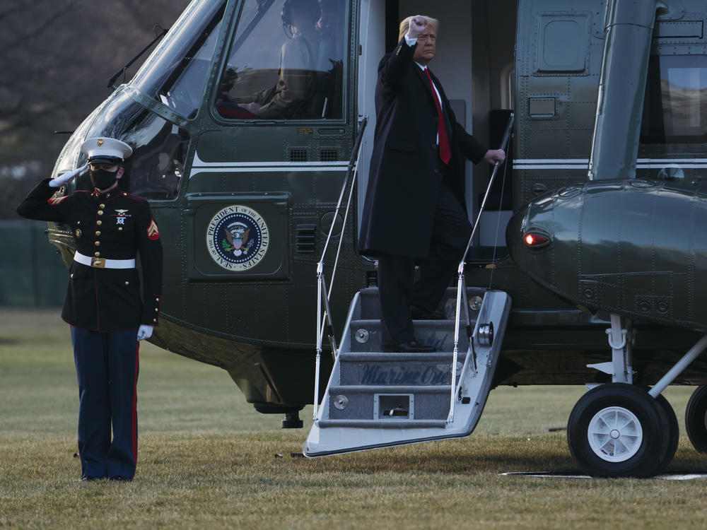 President Trump and first lady Melania Trump board Marine One as they depart the White House on Wednesday. The Trumps did not attend the inauguration of President-elect Joe Biden and Vice President-elect Kamala Harris.
