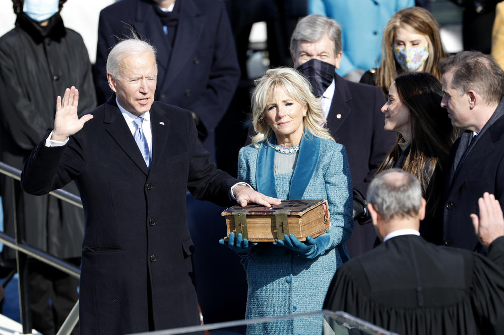 Supreme Court Chief Justice John Roberts administers the oath of office to President-elect Joe Biden.