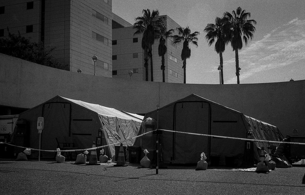 As cases in New York City surge, disaster tents are erected and await use outside of the Los Angeles County-USC Medical Center emergency department in preparation for the worst.