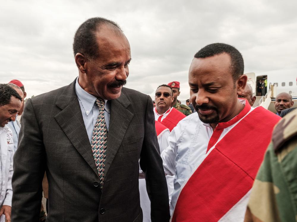 Ethiopia's Prime Minister Abiy Ahmed (right) welcomes Eritrea's President Isaias Afwerki upon his arrival at the airport in Gondar, for a visit in Ethiopia, in November 2018.
