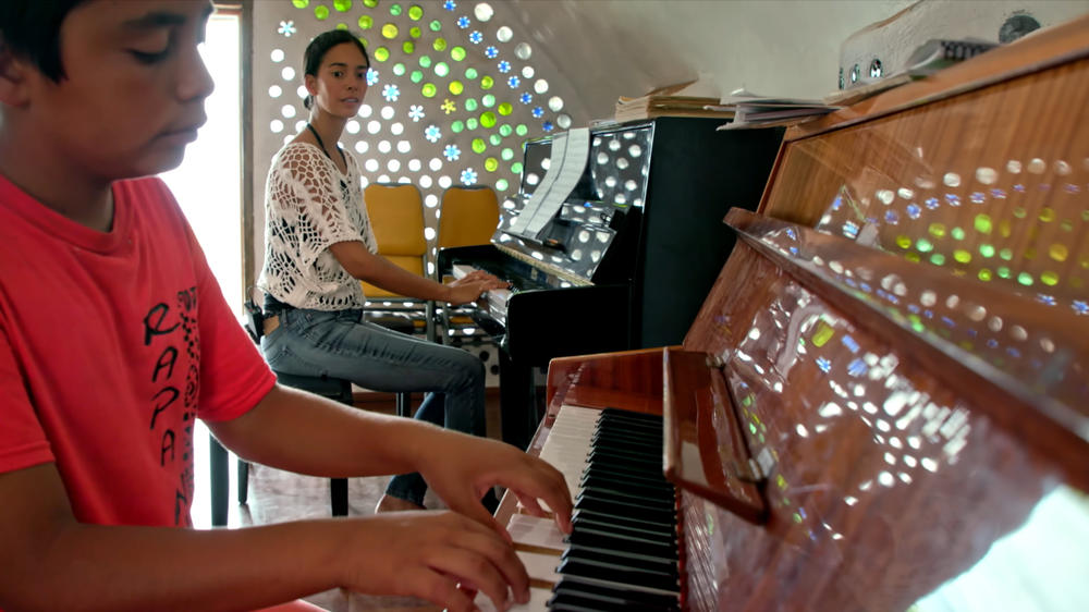 Mahani Teave teaches a student at her Toki School of Music on Easter Island.
