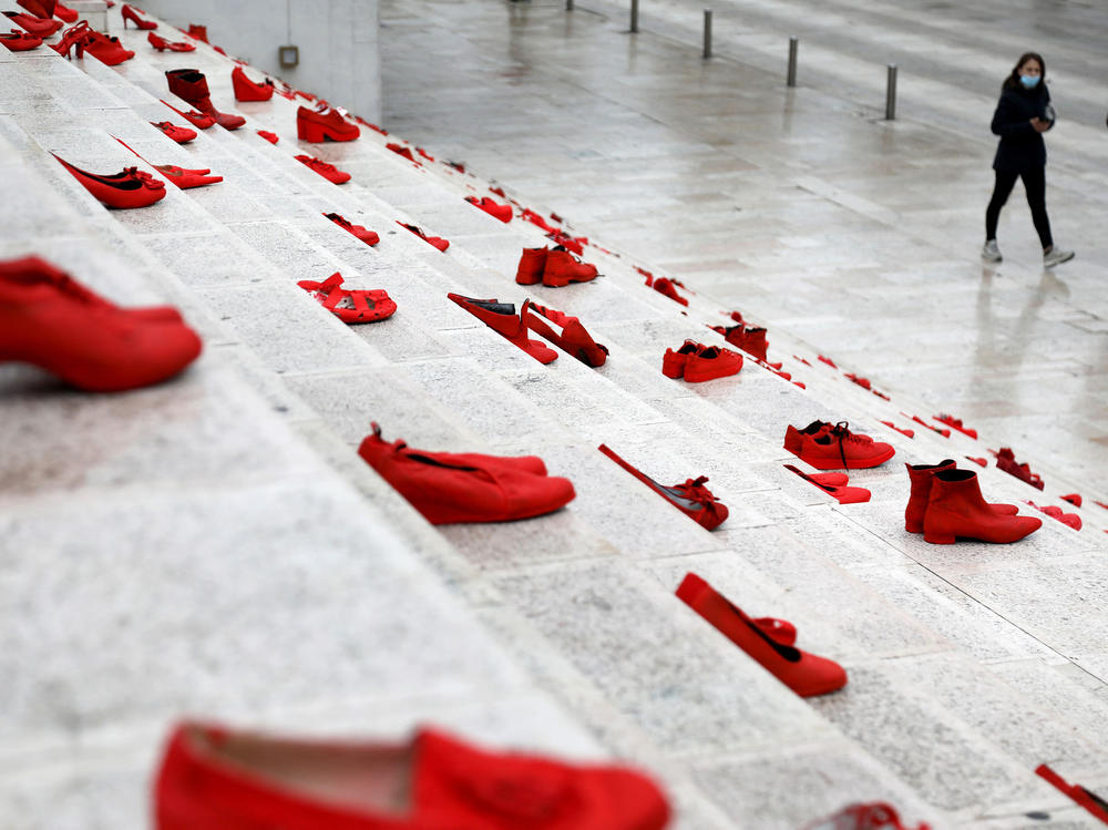 The red shoes are part of a public art installation denouncing violence against women. The photo was taken at Durresi main square in Tirana, Albania, on March 8 — International Women's Day.