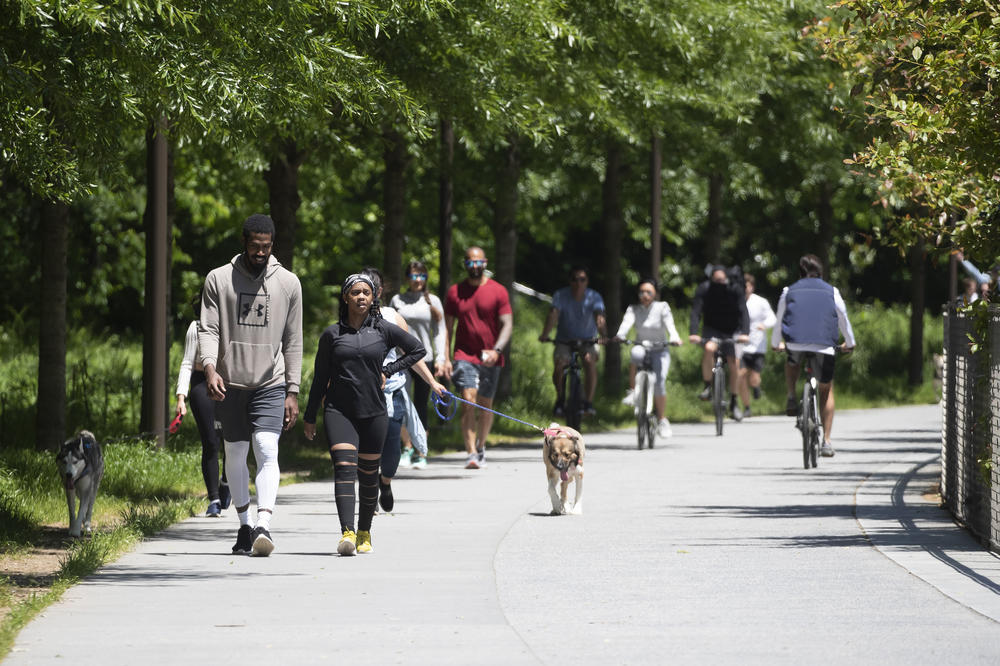 People enjoy the warm weather on the Beltline in Atlanta on May 1, 2020, shortly after the state's shelter-in-place order expired.